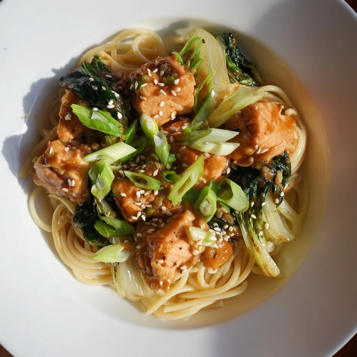 Creamy miso butter salmon pasta, with tender salmon and greens, is an inviting dinner idea.