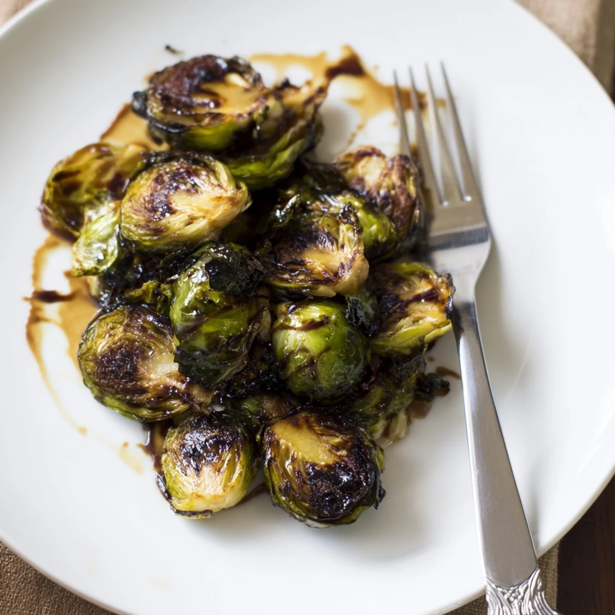 Close-up of crispy Brussels sprouts tossed in olive oil and finished with sweet balsamic vinegar syrup.