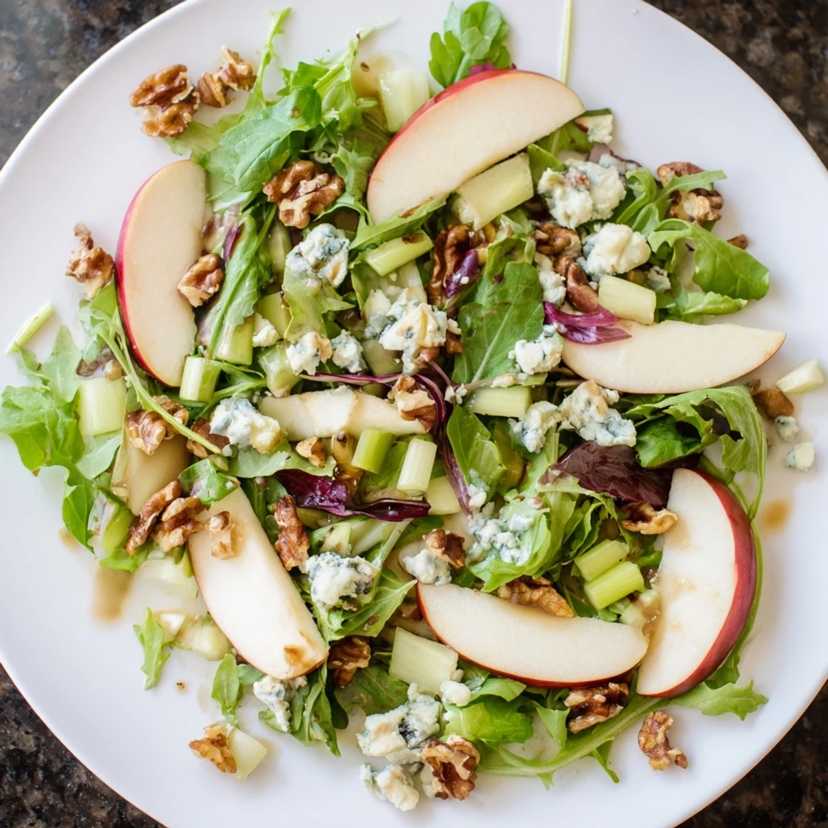 A vibrant bowl of Apple and Walnut Salad, perfect as a light appetizer or side dish.