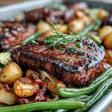 Golden potatoes and perfectly cooked steak on a Father's Day sheet pan dinner.