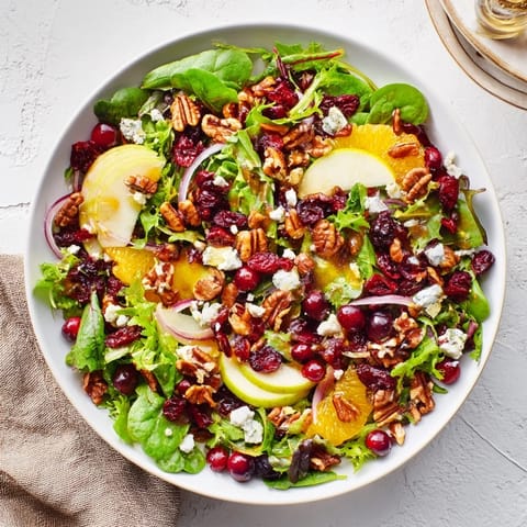 A close-up of a delightful Seasonal Cranberry and Walnut Celebration Salad, perfect for your holiday table.
