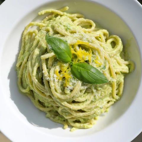 Enjoy this creamy avocado pasta, where a rich, green sauce coats each strand of spaghetti.