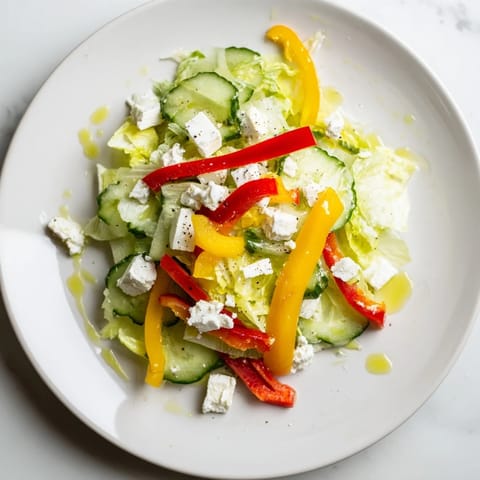 Bright, refreshing Bella Hadid Salad with crisp romaine, cucumbers, and peppers, ready to eat now.
