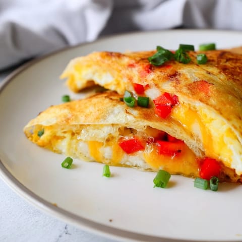 Visualize the savory Rice Paper Egg Cheese Wrap: a quick, easy, and cheesy breakfast delight.