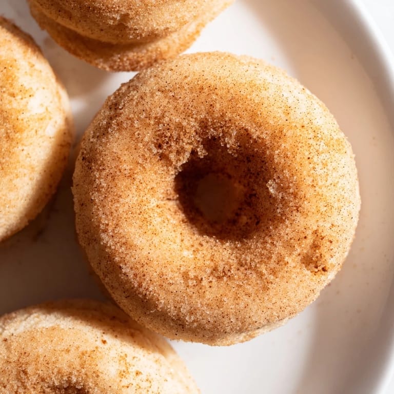 Freshly air-fried donuts with a tender crumb, dusted in warm cinnamon sugar and ready to serve from the basket.  
